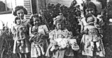 "Showing off" their dolls, Christmas 1946